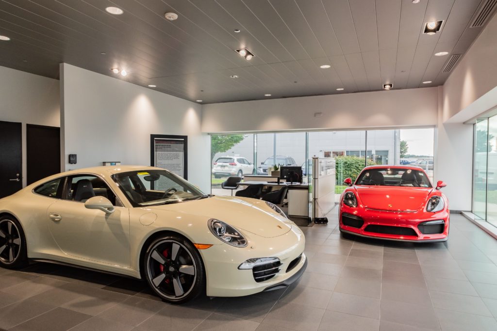 Gardner/Fox converted an existing multi dealership facility into a single tenant Porsche dealership. The renovation included finish upgrades to two separate showrooms for both new and pre-owned vehicles, sales offices, customization center, customer waiting areas, conference rooms, accessory shop, as well as a full service facility. Exterior upgrades include a new façade and new signage for both sales and service. New construction of an indoor customer drop off area featuring a valet provides a pleasant experience for guests in need of vehicle service.