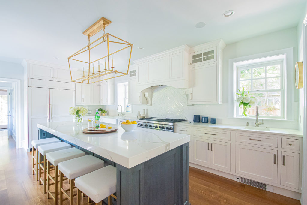 This timeless renovation focused on creating functional spaces and better traffic flow on the first floor of a 1911 colonial style home. Combining the kitchen and dining room created an open-concept gathering space that increased traffic flow to the newly created spaces.