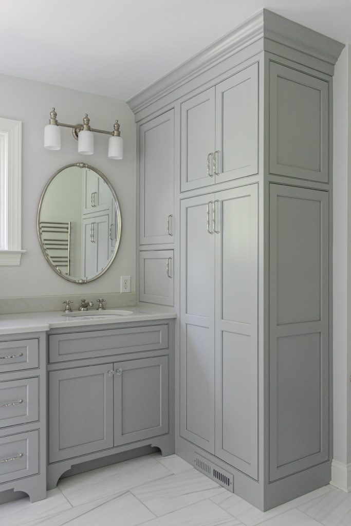 Traditionally Designed Master Bathroom Linen Storage