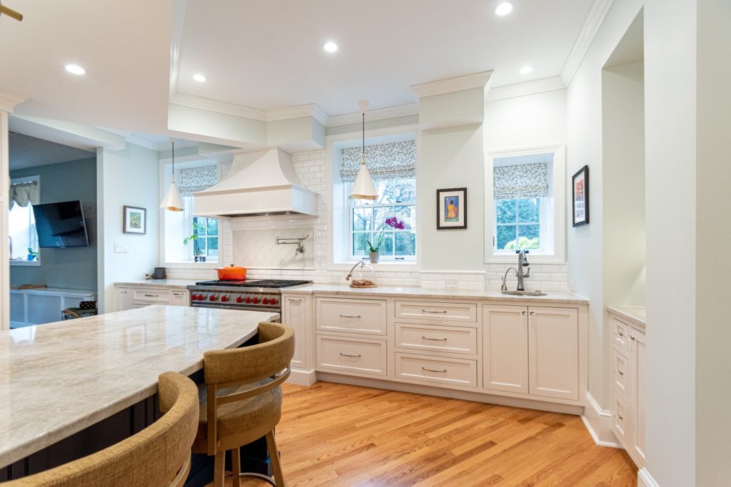 airy transitional kitchen range custom hood white kitchen