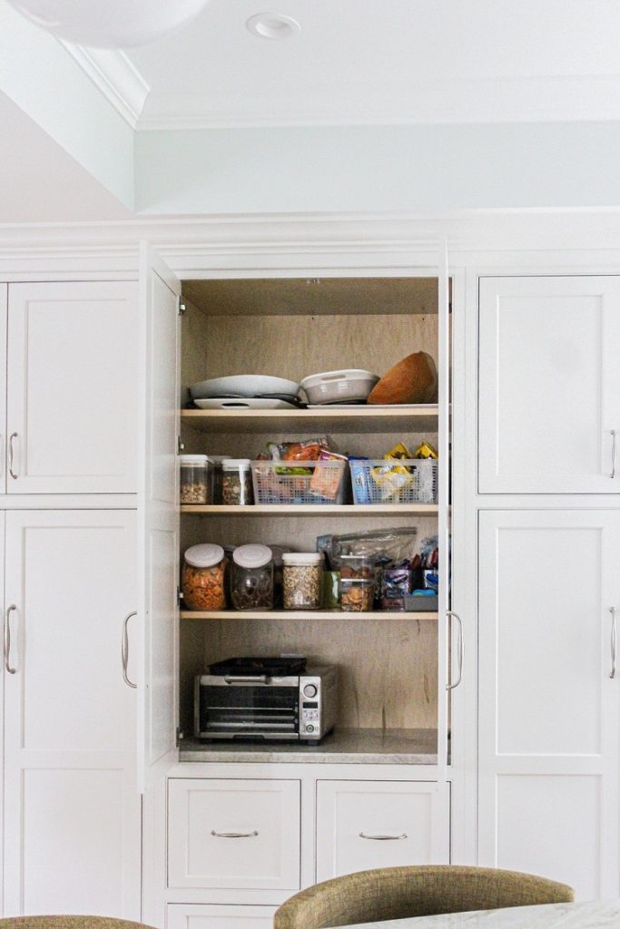 airy transitional kitchen renovation build custom cabinetry pantry wall