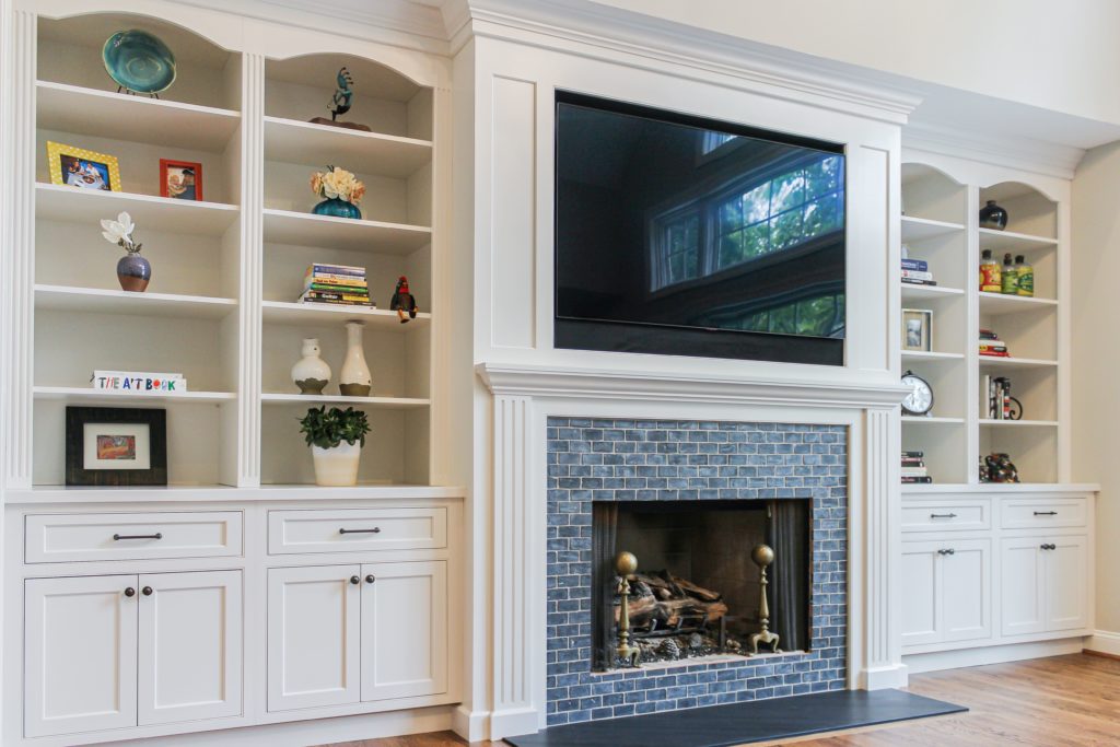 custom designed family room storage shelves and cabinets