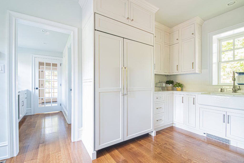 timeless traditional white kitchen paneled appliance details