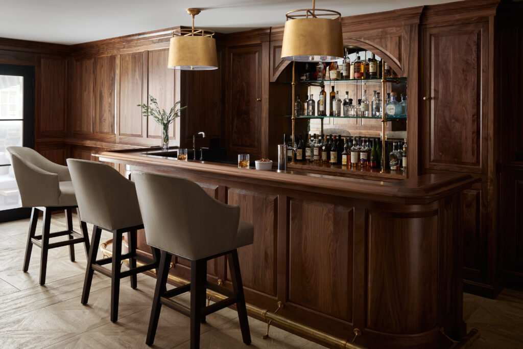 We just turned a regular basement into a chic bar, ideal for hosting memorable get-togethers. Picture a sophisticated upscale bar with walls adorned in luxurious wood paneling - our space effortlessly blends style with functionality.